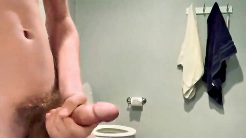 Young amateur guy strokes his thick hard cock in bathroom mirror selfie.