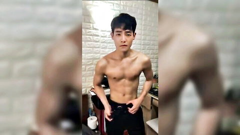 Sexy shirtless Korean guy posing muscularly for modeling contract