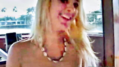 Smiling blonde topless on yacht enjoying fuck session