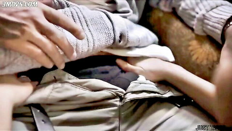 Two sweater-clad MILF hands pull down man's khaki pants exposing his crotch bulge in steamy threesome tease