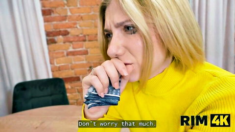 Blonde woman in yellow sweater looks concerned, from RIM4K rimming tutorial video