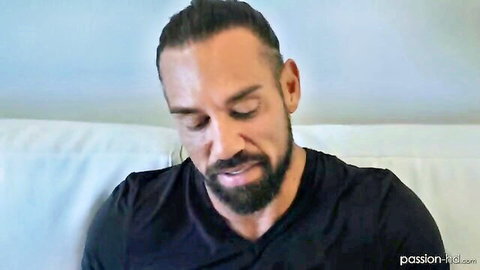 Handsome bearded man in black shirt, close-up from Amber Moore's passionate HD domination scene