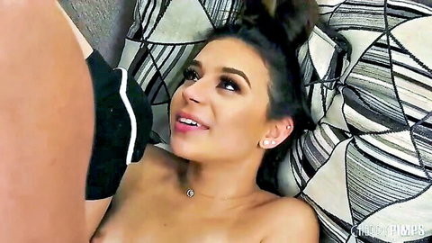 Aria Valencia topless giving blowjob on bed, seductive eyes up close