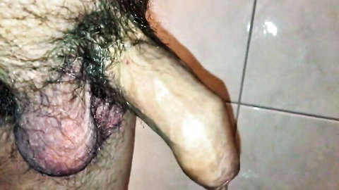 Close-up of hairy erect cock and balls, first 2018 cumshot preview