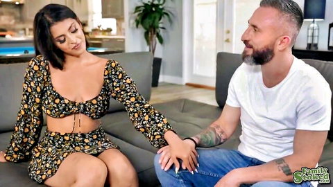 Sultry Sophia in floral dress touches Ike Diezel on couch, teasing intimacy