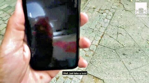 Dirty Priscilla public tease with Steven Shame, hand holding phone inviting a peek