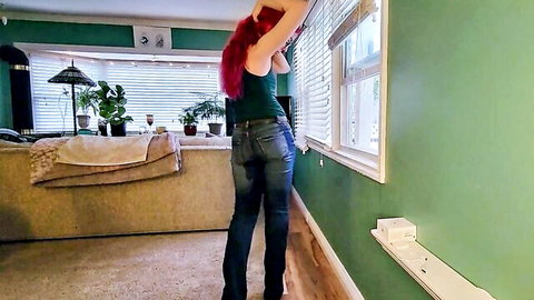 Nerdy redhead faery in tight jeans and tank top posing seductively