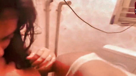 Desi Indian woman fingering herself in steamy bath solo masturbation