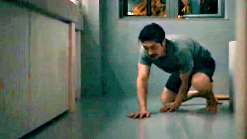 Asian man crouching tensely in Expats s01e01 bathroom scene with Nicole Kidman