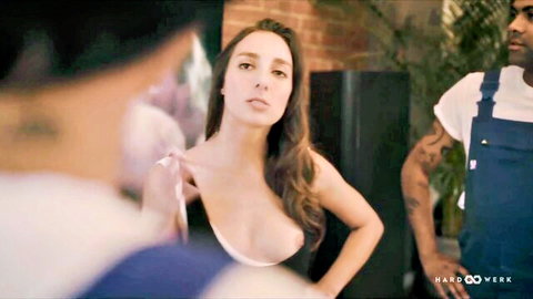 Busty brunette pulls down top exposing huge tits and hard nipples to black guy in threesome tease