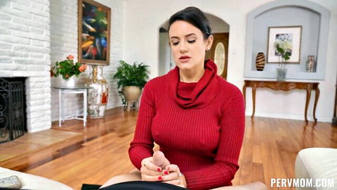 Penny Barber in tight red turtleneck sweater, seductive pose on couch