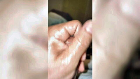 Blurry close-up of shiny, muddy hand fingers in explicit adult fun