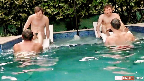 Naked white men lounging by pool in Family Time gay scene