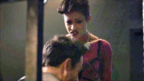 Ebony woman in red lace top dominates submissive man in intense scene