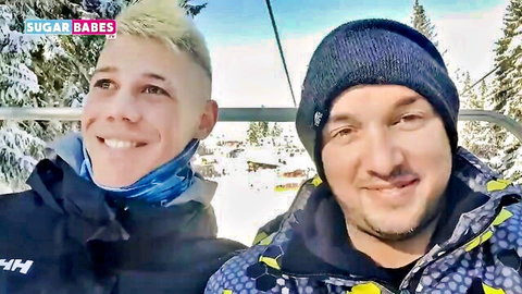 Two smiling men on ski lift in winter gear, SugarBabesTV midget porno thumbnail