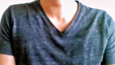 Young Asian webcam boy in fitted gray V-neck T-shirt, upper body tease