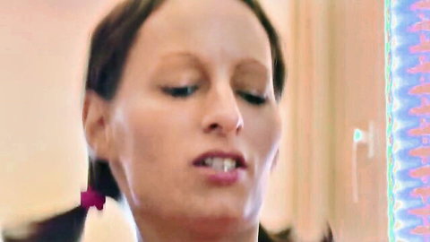 Ponytailed brunette sweetheart with open mouth in teasing closeup