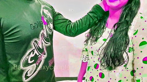 Banglasexycouple in teasing embrace, man in green shirt arms around woman in dotted dress