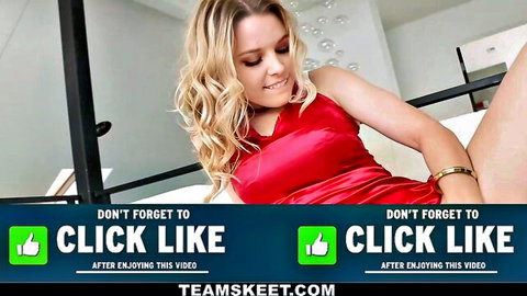 Blonde woman in sexy red satin dress smiling seductively