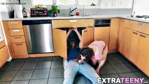 Skinny brunette teen sucks big cock under kitchen sink plumber style