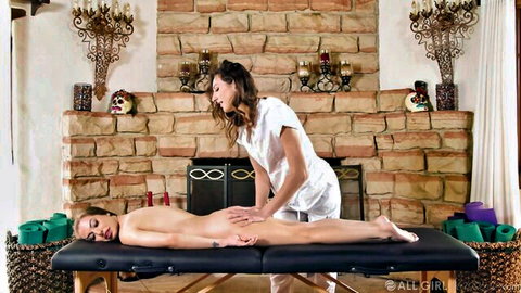 Spencer Bradley nude on massage table, masseuse rubbing her ass
