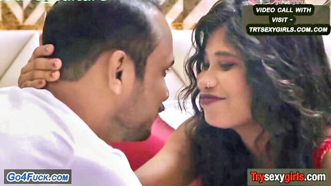 South Asian couple in intense passionate kiss with man grabbing woman's neck