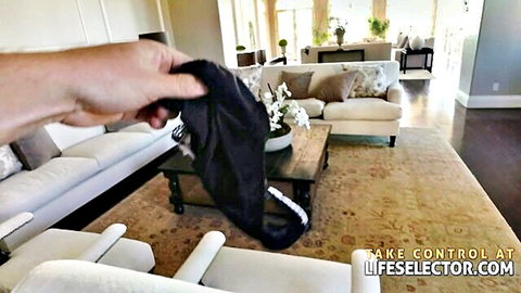 POV hand dangling sexy black thong panties in luxury living room tease