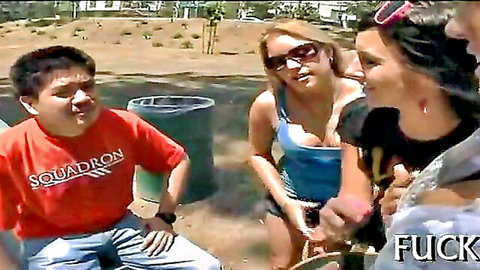 Outdoor group teasing with young Asian guy and busty blondes in park, explicit fun
