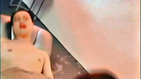 Shirtless Chinese cosplayer lying back in relaxed pose
