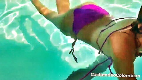 Colombian woman in purple bikini floating in pool, stranger money offer scene