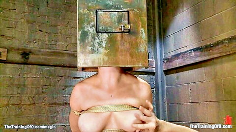 Audrey Hollander bound topless in BDSM gangbang training