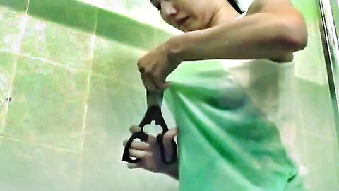Japanese girl in shower cuts wet transparent shirt with scissors exposing perky tits