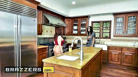 Two busty brunettes in skimpy outfits tease with big asses exposed in kitchen