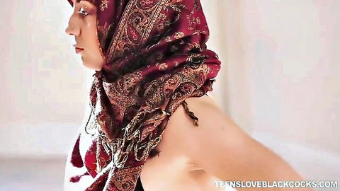 Muslim babe in red hijab, bare shoulder profile view