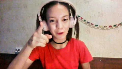 Loriatheos shy 18yo skinny teen in red top with headphones pointing on Chaturbate