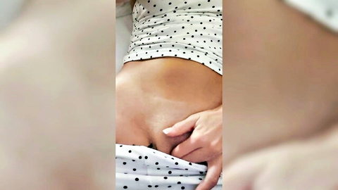 Teen with big boobs in polka dot top, hand in panties during dildo masturbation