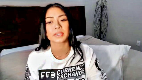 YourGoddessLu webcam tease in oversized white t-shirt, sultry gaze