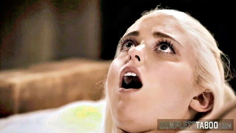 Blonde teen with wide eyes and open mouth in intense pleasure