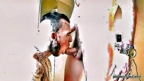 Tattooed guy with piercings giving intense oral to big thick cock