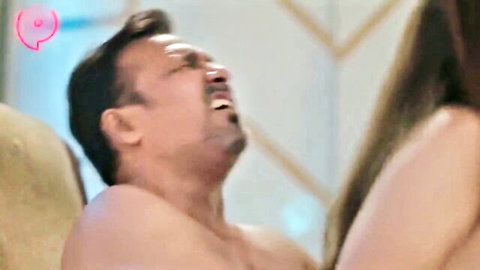 Indian couple in intimate Hindi web series, shirtless man laughing with long-haired woman