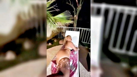 Blonde babe lies topless on outdoor lounge chair exposing bare ass and wet pussy