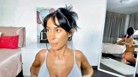 Sincerelyc in revealing white tank top, teasing ass view in mirror on Chaturbate