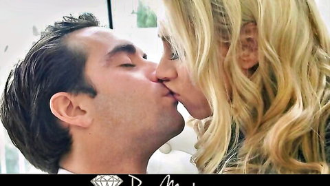 Blonde bombshell with huge tits passionately kissing handsome stud close-up