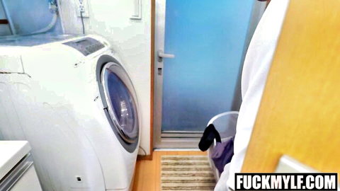 MILF stepmom in white robe bending near washing machine in laundry
