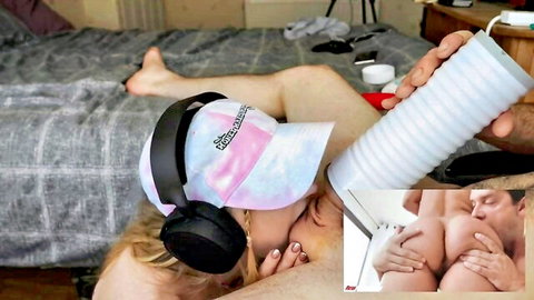 Skinny blonde with headphones and cap gets pussy penetrated by fleshlight toy on bed