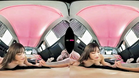 Asian nymph lying nude in pink van, seductive pose with hand near crotch