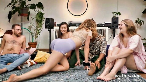 Three excited hotties in shorts and robes tease two shirtless guys during truth or dare game