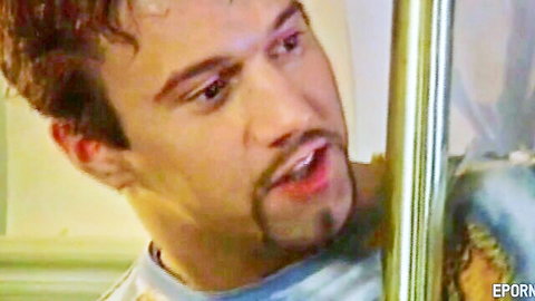 Handsome Caucasian man with goatee in blue shirt, teasing nurse patient scene