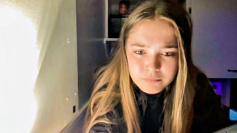 lanelizzie348 blonde cam girl with seductive gaze in black top
