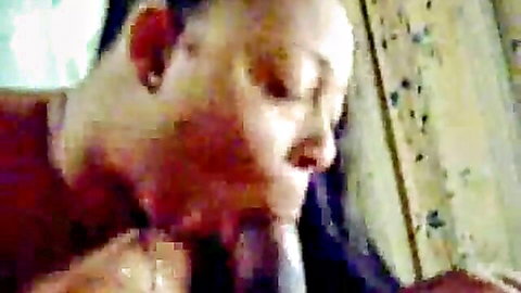 Ebony woman with full lips sucking thick black cock in intense closeup blowjob